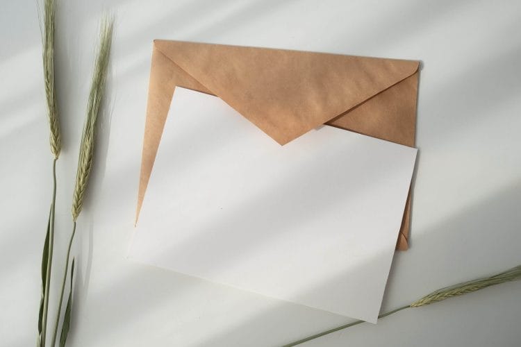 Envelope with paper and pen.